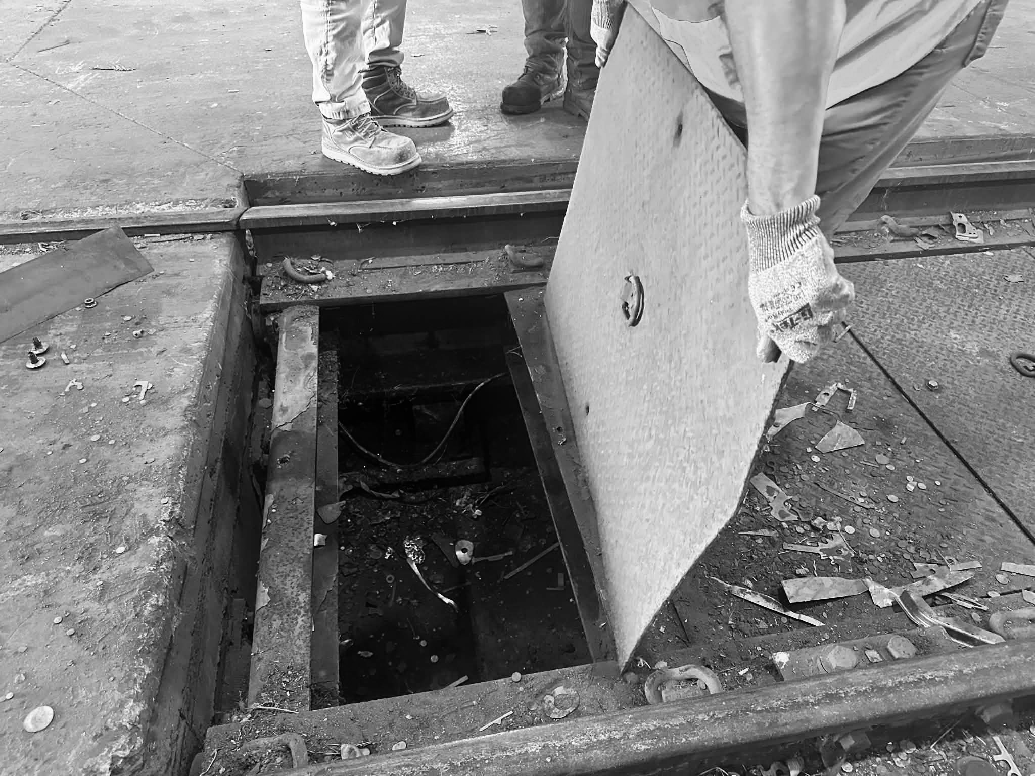 looking inside rail scale at debris