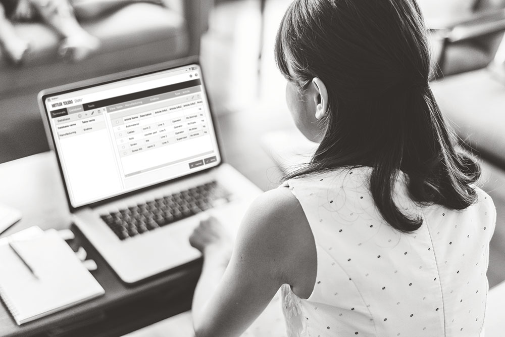 woman reviewing data from METTLER TOLEDO data+