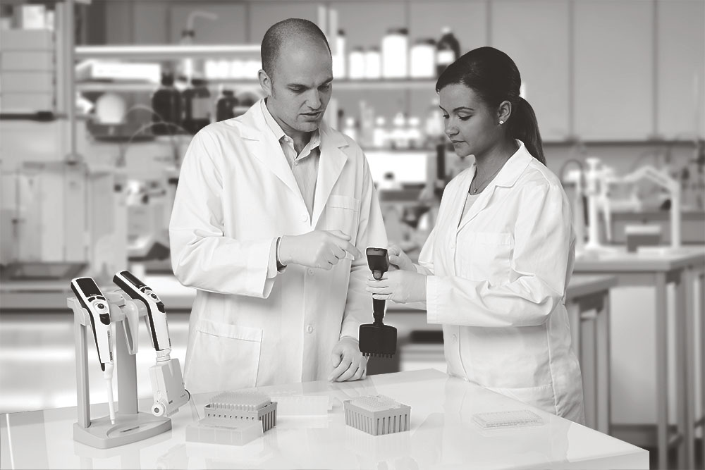 two scientists using a variety of E4-XLS in a lab