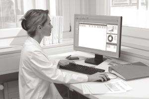 technician reviewing balance results on pc