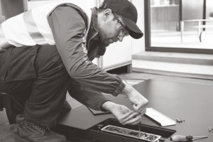 technician working on an aggregates, metal and plastics, or transport and logistics scale