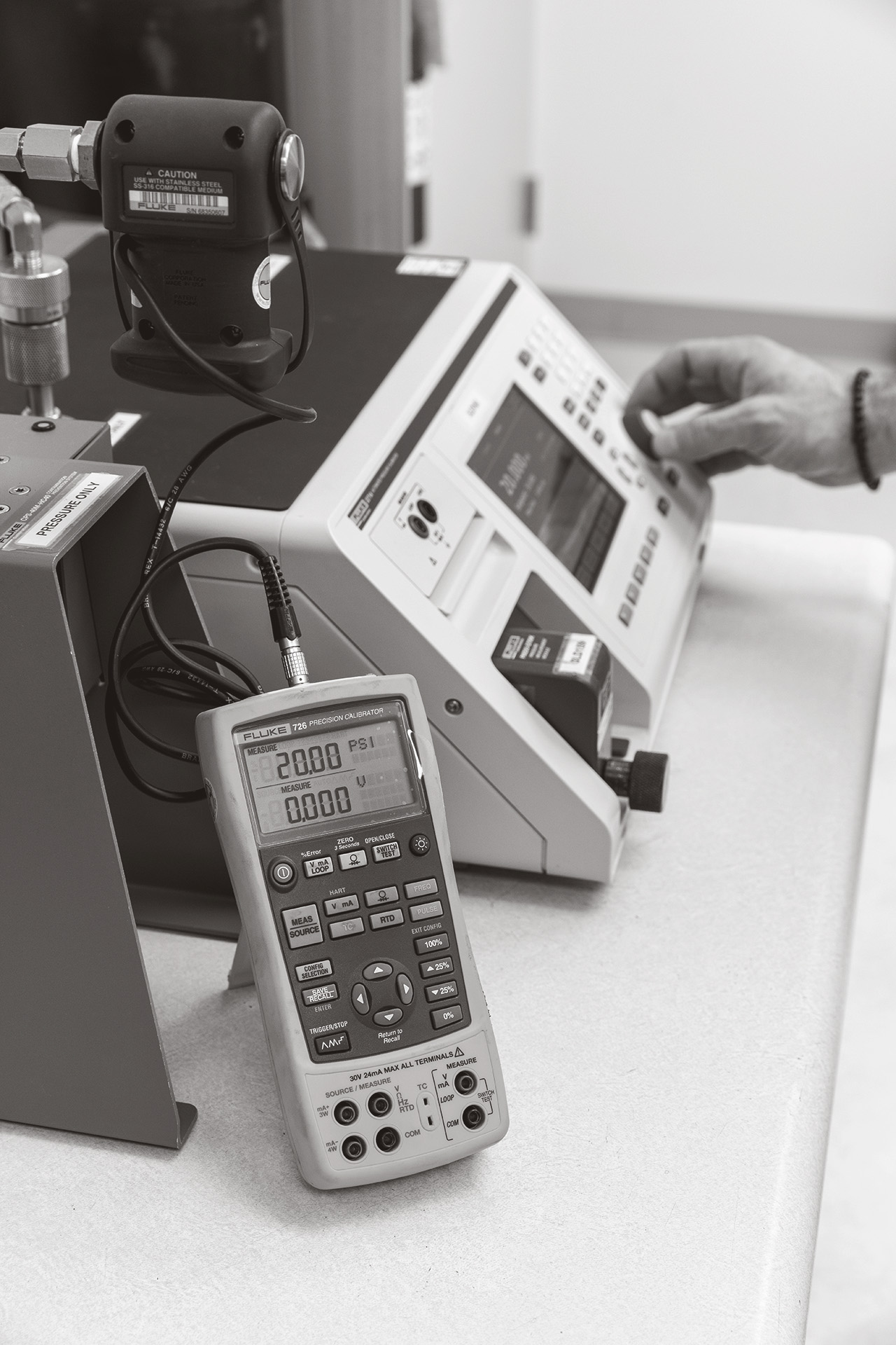 Engineer calibrates an industrial scale