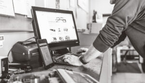 System Scale engineer looking up information on a Lenovo monitor.