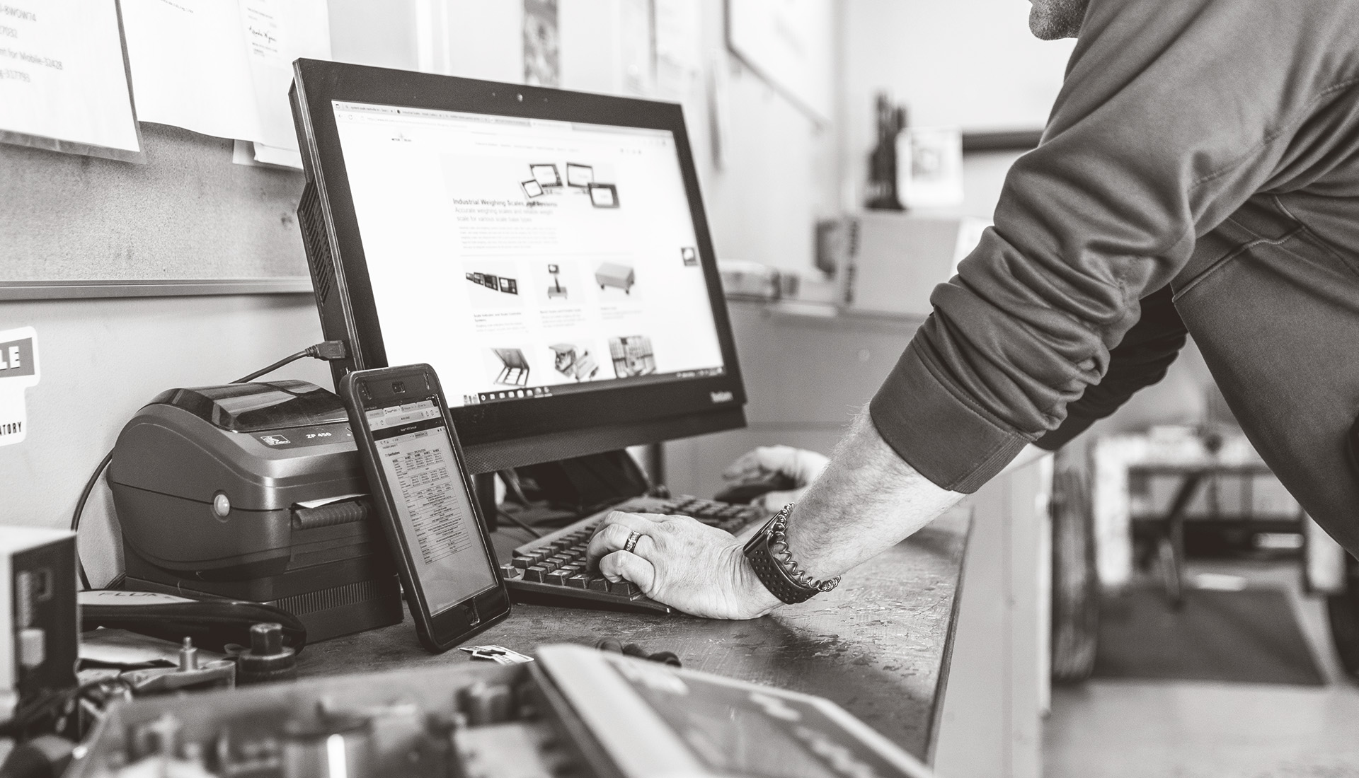 System Scale engineer looking up information on a Lenovo monitor.