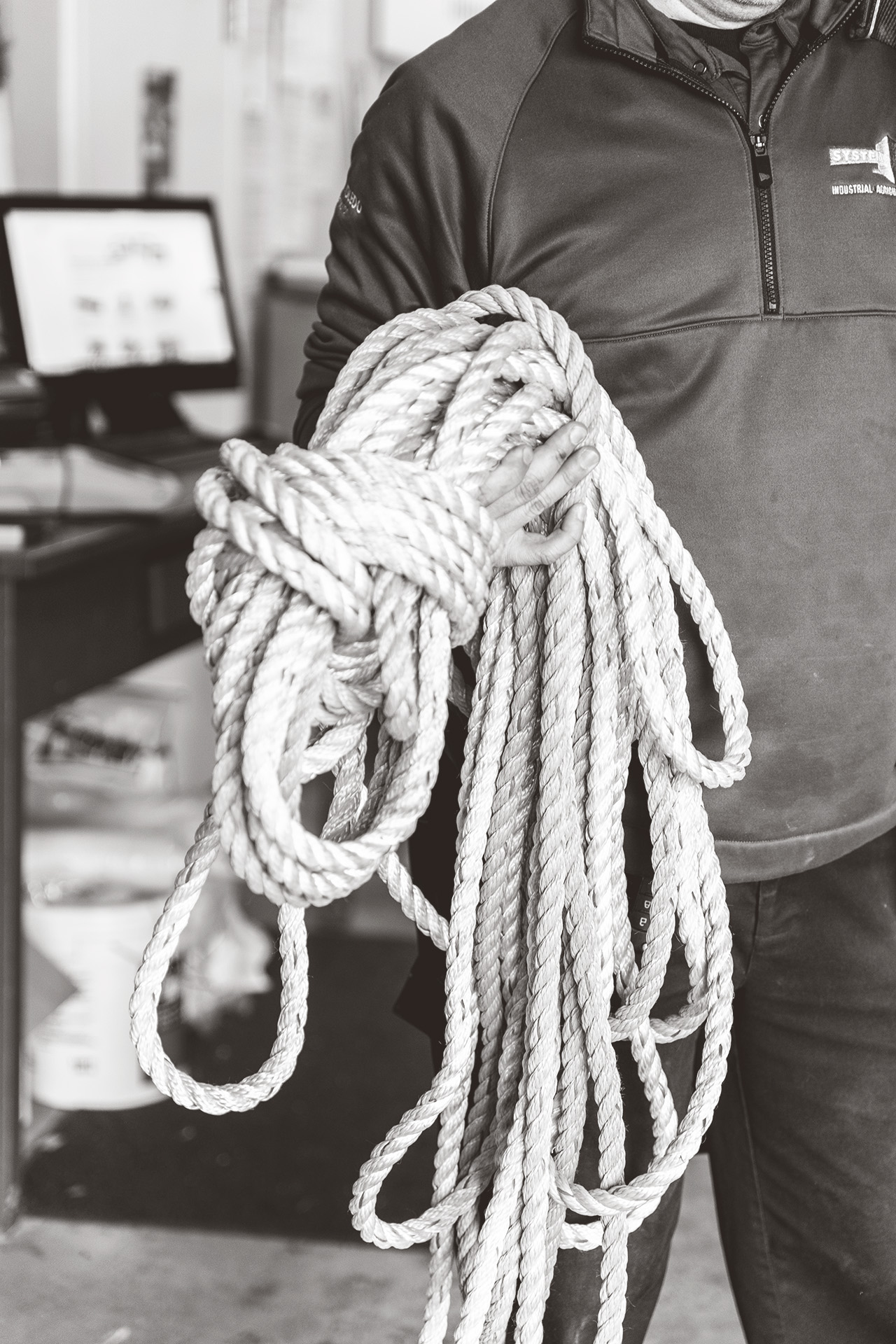 System Scale engineer holding a spool of rope